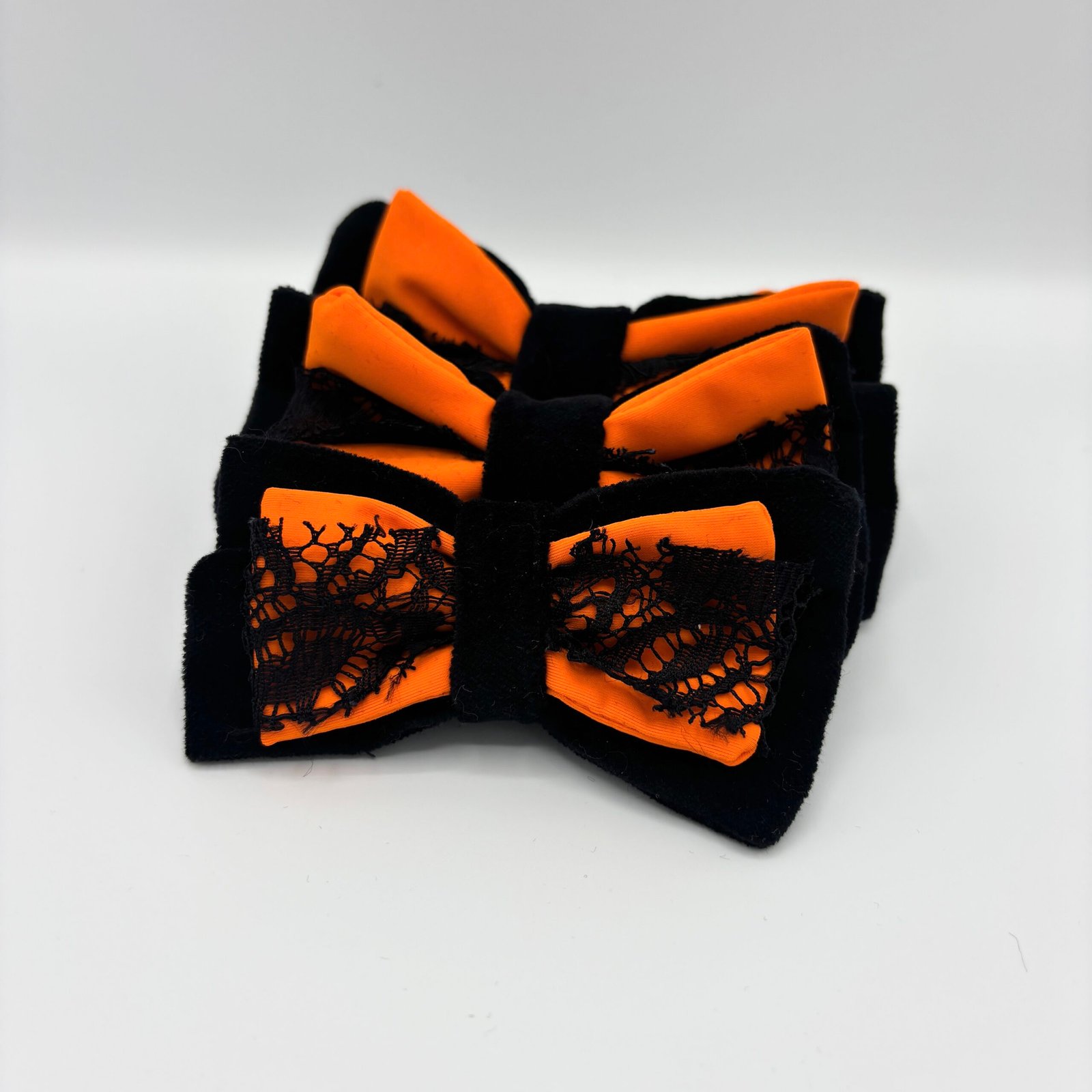 Halloween dog bows in three sizes with black velvet and orange fabric
